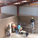 plastering wall in warehouse